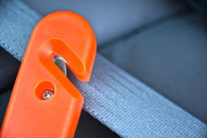 Automotive Emergency Tool With Seatbelt Cutter And Window Punch